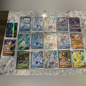 Pokémon TCG lot w/ V, VMAX, Leafeon GX, full art, unopened tin & extras